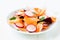 Beet carrot radish salad on white plate