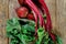 Beet harvest with tops on a wood background