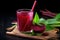 beet juice in a clear glass with a straw and beetroot beside