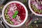 Beet smoothie bowl with chia seeds, coconut, pumpkin seeds, quinoa, sunflower seeds and mint