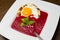 Beetroot cream soup with fried egg and bacon