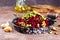 Beetroot salad with wallnuts and garlic in bowl on wooden table. Selective focus