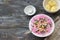 Beetroot soup, svekolnik, holodnik, on kefir, with cucumber, boiled eggs and greens on wooden table