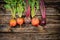 Beetroots on wooden background. Ripe yellow, orange and purple beets