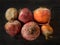 Beets in different colors on a dark background