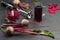 Beets with tops, sliced beets. Glass of beetroot juice. Sliced beet in blender jar