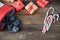 The Befana sock with sweet coal and candy on wooden background. Italian Epiphany day tradition.