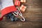 The Befana sock with sweet coal and candy on wooden background. Italian Epiphany day tradition.