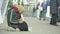 Beggar homeless woman. Poverty. Vagrancy. Kyiv. Ukraine.