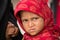 Beggar indian girl begs for money from a passerby in Srinagar, Kashmir. India