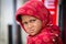 Beggar indian girl begs for money from a passerby in Srinagar, Kashmir. India