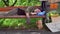 Beggar on lying on bench, hat with coins and board with sign need money on ground.