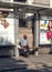 Beggar sitting on a bench