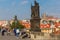 Beggar and tourists on the Charles Bridge in Prague