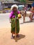 A begging old woman in India