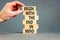 Begin in end of mind symbol. Concept words Begin with the end in mind on wooden blocks. Beautiful grey table grey background.