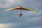 Beginner girl pilot with colorful hang glider wing