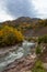 The beginning of autumn in a mountainous area, a river and a forest.