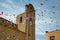 Begur, Costa Brava, Catalonia, Spain: Church Sant Esteve d`EsclanyÃ  with colored flags.