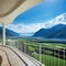 from behind standing on the balcony of luxurious hotel with sweeping views of