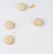 Beige baked macarons of almond anguish broken down on a white background
