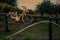 Beige bicycle parked on a wooden post near a sandy beach