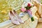 Beige bride`s shoes standing near fresh wedding bouquet