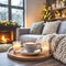 Beige chunky knit throw on grey sofa. Ð¡offee table with candles against fireplace. Scandinavian farmhouse, hygge home interior