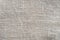 Beige creased linen fabric texture background