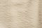 Beige creased textile background texture