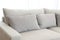 Beige cushion on grey sofa