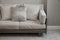 Beige cushion on grey sofa