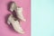 Beige female dance jazz shoes on pink blue pastel background flat lay