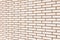 Beige fine brick wall texture background perspective, large detailed horizontal textured pattern