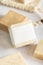 Beige handmade soap bar with blank label close up, packaging mockup
