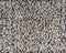 Beige heather boucle fabric made of wool fibres textured background.