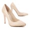 Beige high heel shoes isolated on white