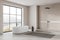 Beige hotel bathroom interior with tub, douche and panoramic window