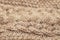 Beige knitted background medium thickness thread