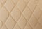 Beige leather Mat with straight beige stitching soft leather for machine with textured pattern concept background business