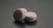 Beige macarons on slate background