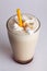 Beige milkshake with straw