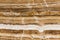 Beige onyx marble decorative stone texture with abstract lines.