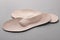 Beige orthopedic insoles on light grey background, closeup