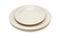 Beige plate and saucer isolated