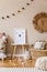 Beige playroom for kids with cute natural animal toys and poster in cosy Scandinavian style.