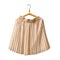 Beige pleated skirt on a hanger. White background. Isolate