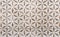 Beige porcelain tiles with ornament. Background and texture of porcelain tiles