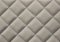 Beige quilted fabric background