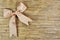 Beige ribbon on a wooden background